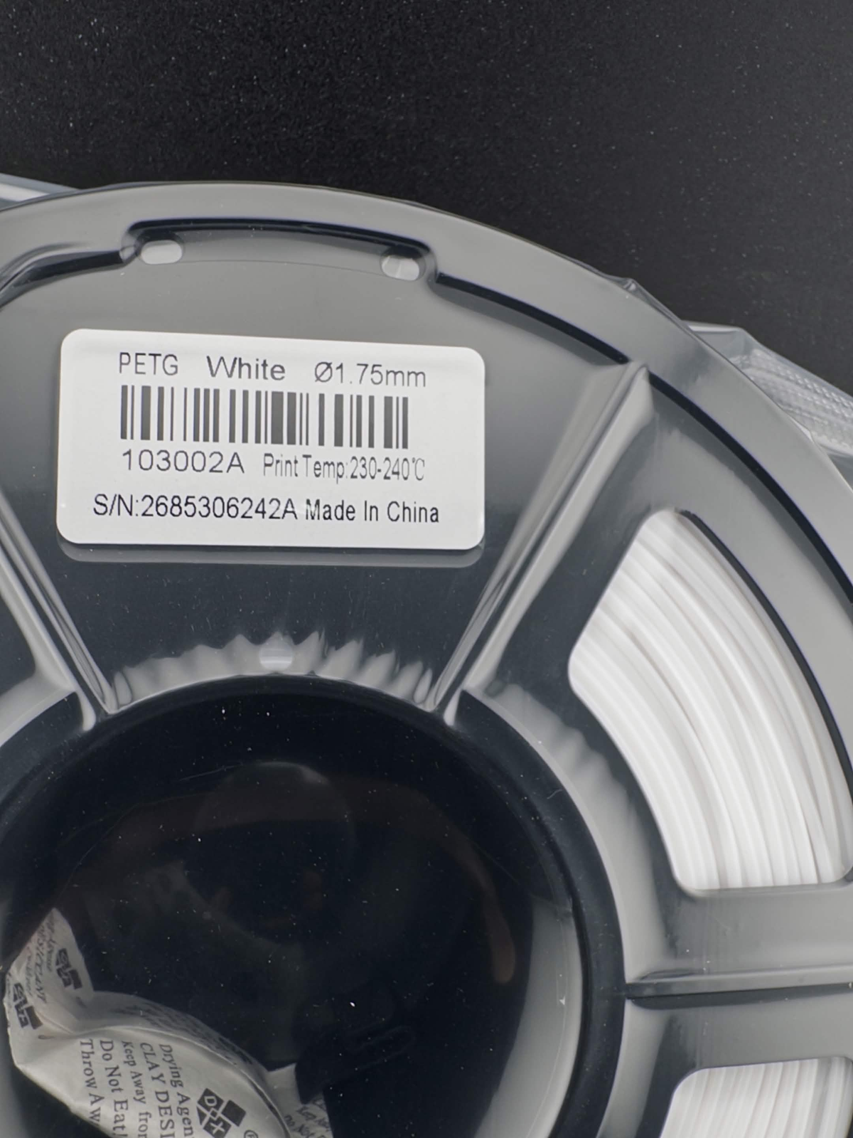 SUNLU PETG White 1.75mm filament sealed spool and product label